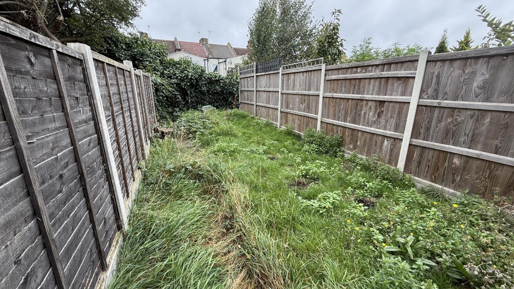 Lot: 56 - TERRACED HOUSE FOR REFURBISHMENT - External image of garden looking back from house